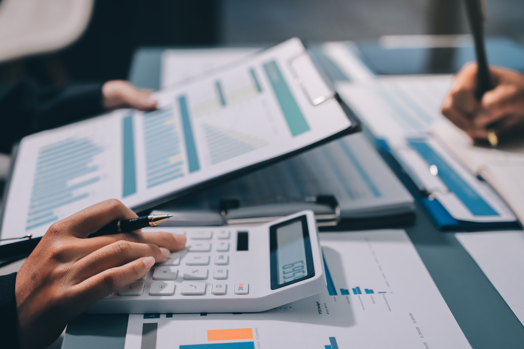 Fund managers team consultation and discuss about analysis Investment stock market at office